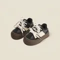 Stijlvolle casual kindersneakers in zwart en beige met een warme pluche voering - Zwart