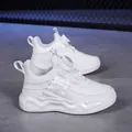 White children's running shoes featuring a quick-release rotating dial buckle system - 28 / White