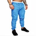 Light blue men's slim fit cargo joggers featuring side pockets and elastic cuffs - S / Bottoms / Sky Blue