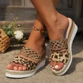Close-up of leopard print wedge sandals with rope-wrapped platform sole and braided straps. - Leopard Mesh