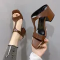 Stylish brown women's square-toe mules featuring a comfortable block heel and T-strap design. - 35 / Brown