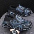 Men's outdoor winter clogs with warm plush lining and waterproof graphic design for comfort. - Black Blue
