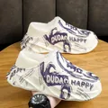 White chunky platform clog slippers with purple graphics and warm fleece lining - Beige Blue