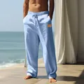 Detailed view of men's loose light blue cotton linen beach trousers with drawstring - S / Bottoms / Light Blue