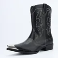 Detailed view of vintage black cowboy boots with white embroidery and metal toe cap - 40 / Black