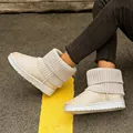 Detail view of beige thick-soled snow boots with knitted cuffs and warm fleece lining - 35 / Off White