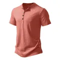 Close-up detail of coral red men's short sleeve Henley shirt with three-button placket - Pink