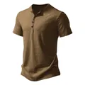 Detailed view of the textured fabric and button placket of a men's brown Henley shirt. - S / Tops / Khaki