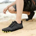 Black quick-dry barefoot water shoes with white wave pattern and neon green sole - Black