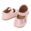 Detailed view of pink shiny baby girl princess shoes with glitter butterfly detail - Pink