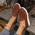 Detailed view of women's brown knitted slip-on shoes with white textured thick soles - 35 / Dark Brown