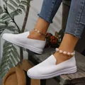 Detailed view of white knitted women's loafers with a thick sole on model - 35 / White