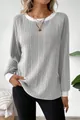 Close-up of a casual gray ribbed long-sleeve sweater featuring elegant white trim details. - S / Tops / Gray