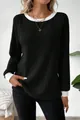 Detailed view of women's black ribbed knit sweater with contrasting white crew neck and cuffs. - S / Tops / Black