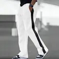 Detail of men's heavy white sweatpants with a bold black side stripe and drawstring waist. - S / Bottoms / White