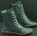 Detailed side view of teal leather ankle boots featuring unique lacing and side zipper - 35 / Green