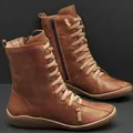 Classic brown faux leather ankle boots with detailed lace-up and functional side zipper - Tan