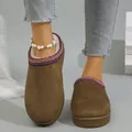 Close-up of brown suede platform snow boots with ethnic patterned trim and fur lining - 36 / Brown