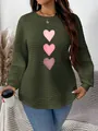 Detail of green quilted sweatshirt featuring pink heart prints and curved hemline - 3XL / Tops / Army Green Pink Heart