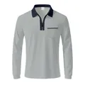 Close-up of a men's grey long-sleeve polo shirt featuring a black zipper collar and pocket - Gray and Navy Blue