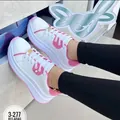 Detailed view of women's chunky white and pink platform sneakers featuring a lace-up design - 36 / Rose Red