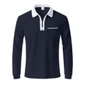 Close-up detail of navy long-sleeved polo shirt featuring white contrast collar and zipper - S / Tops / Navy Blue and White