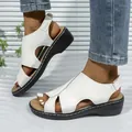 Detail view of white casual wedge sandals with stitching and hollow-out design - 36 / White
