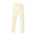 Vista frontal de los pantalones deportivos oversize para hombre en color crema con cordón - Albaricoque