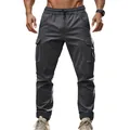 Front view of men's dark grey tactical cargo pants with elastic waist and side pockets - Dark Gray