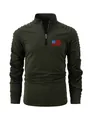 Detail view of olive green men's long sleeve polo shirt with pleated sleeves and flag logo. - Army Green