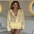 Elegante abito a camicia giallo pallido a maniche lunghe con dettaglio minigonna - Giallo