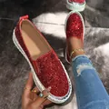 Close-up of red glitter slip-on loafers with thick platform sole and ripped jeans. - 35 / Red