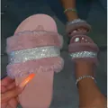 Detail of pink rhinestone fuzzy slipper showing the soft fur and sparkly strap. - 36 / Pink