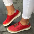 Detail view of women's red perforated loafers with thick white platform soles - 35 / Red