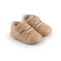 Detail view of tan faux leather baby walking shoes with velcro straps and brogue accents - Inner Length 11cm (2253) / Apricot