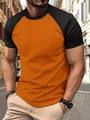 Detailed view of men's slim-fit athletic raglan T-shirt in vibrant orange and black colors - S / Tops / Orange