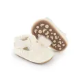 Detail of cream baby walking shoes featuring a decorative mesh bow and non-slip soles. - 11cm / Ivory