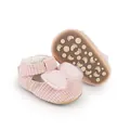 Close-up of pink textured baby pre-walker shoes with large mesh bow and anti-slip sole - 11cm / Pink