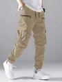 Stijlvolle khaki cargo broek voor heren met meerdere zakken en elastische boorden - Khaki