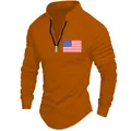 Detail of men's orange long-sleeved polo with pleated sleeves and American flag - S / Tops / Orange