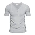 Macro view of grey Henley t-shirt featuring grid texture and two-button neckline - Light Gray