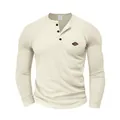 Detail view of a cream waffle-knit Henley shirt showing fabric texture and buttons - S / Tops / Apricot
