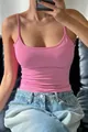 Close-up of pink slim-fit camisole tank top showing soft fabric texture and body-hugging fit - S / Tops / Pink