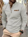 Close-up of men's casual polo shirt featuring plaid collar and pocket detail. - S / Tops / Gray