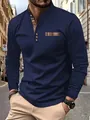 Detail of navy blue long-sleeve polo shirt featuring plaid collar and pocket accents. - S / Tops / Navy Blue
