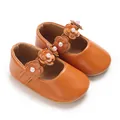 Vue détaillée de chaussures de princesse pour bébé en similicuir orange avec fleurs - Marron