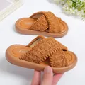 Detailed macro view of girls' cross-woven brown slide sandals with textured straps - 23 / Brown