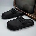 Stylish black EVA outdoor clogs featuring adjustable buckle strap and non-slip textured sole - Black