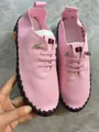 Detailed view of pink handmade stitched comfort loafers with durable flexible rubber sole - Pink