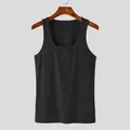 Close-up detail of black ribbed fabric on quick-dry slim fit men's gym tank top vest - S / Tops / Black